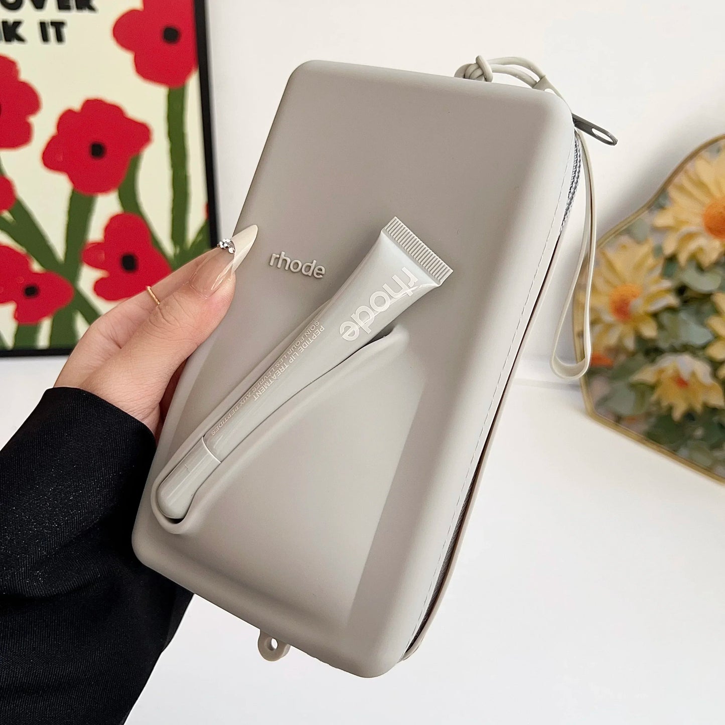 rhode Clutch bag with lip tint