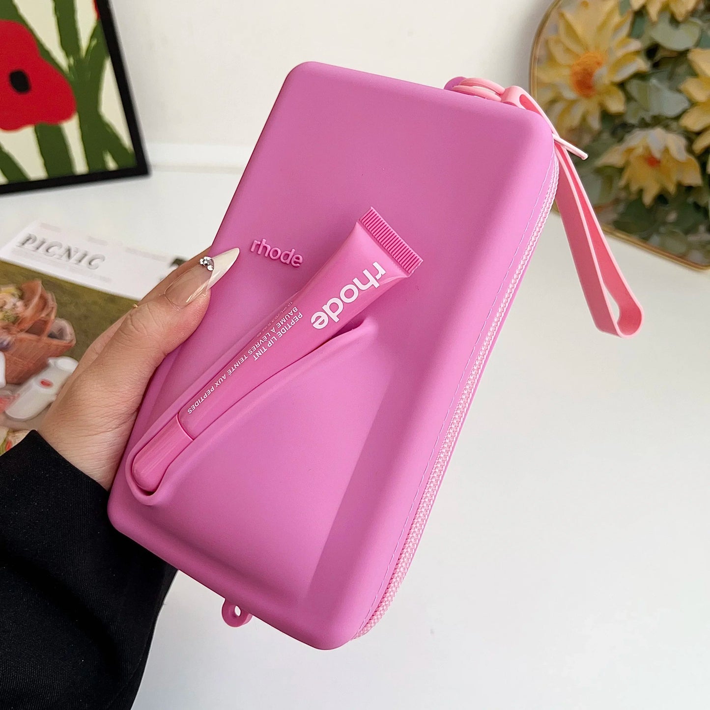 rhode Clutch bag with lip tint