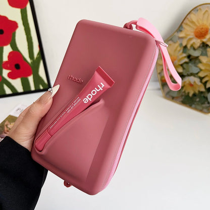 rhode Clutch bag with lip tint